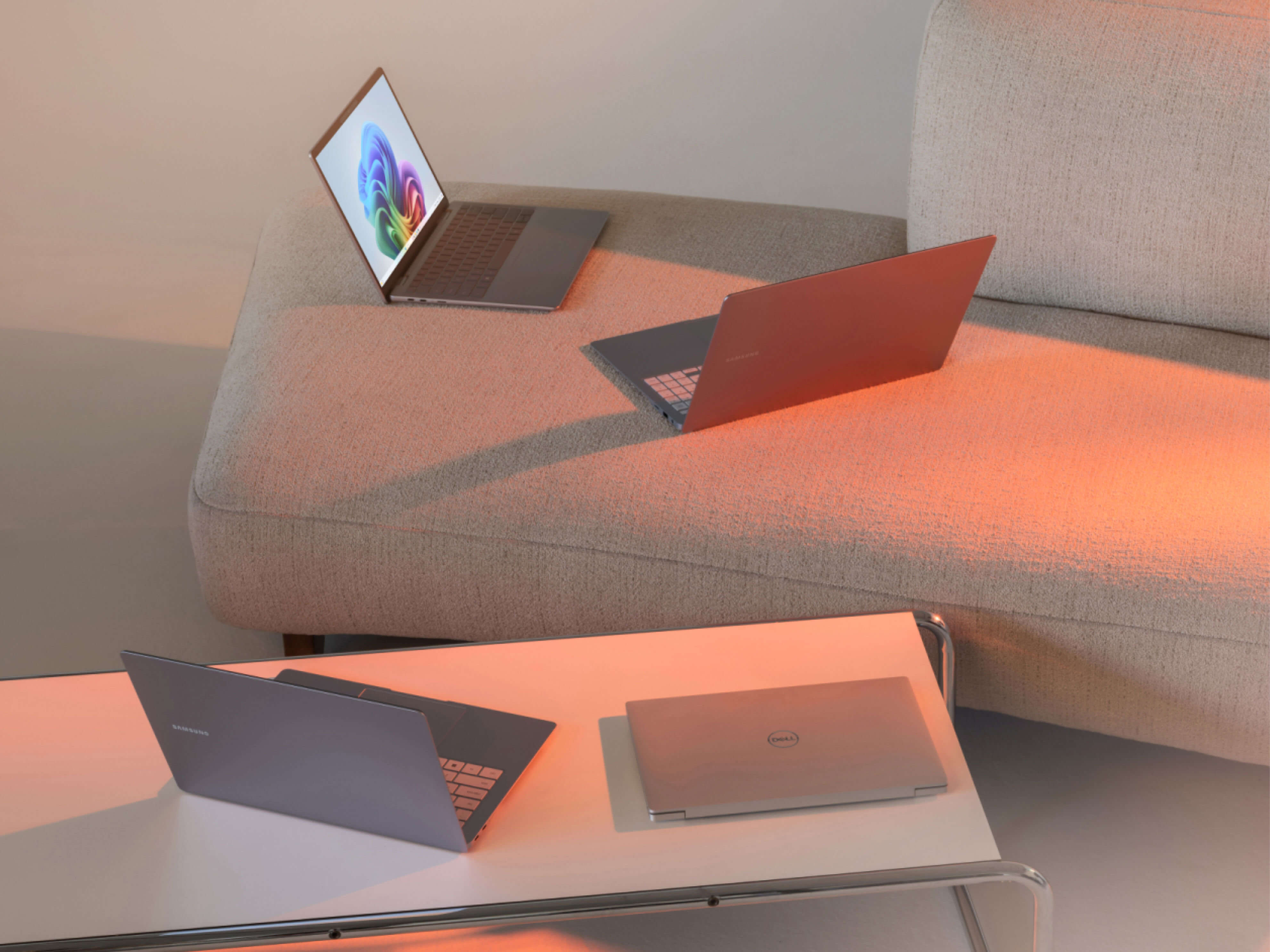 MSFT-Multiple-laptops-sitting-on-a-coffee-table-and-couch-RW1kcv7